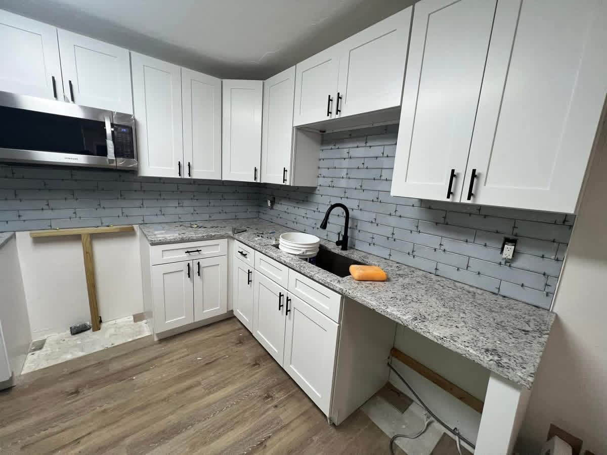 Kitchen before remodel, unfinished cabinetry